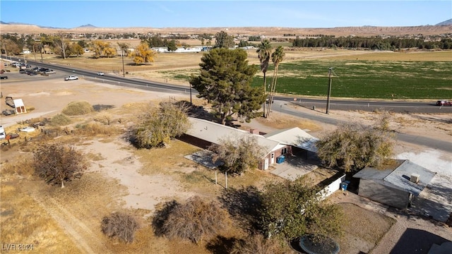 birds eye view of property with a mountain view and a rural view