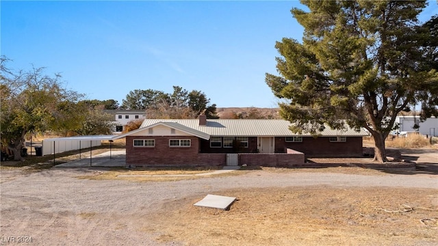 ranch-style house with a carport