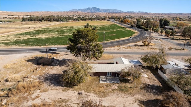 birds eye view of property featuring a mountain view and a rural view