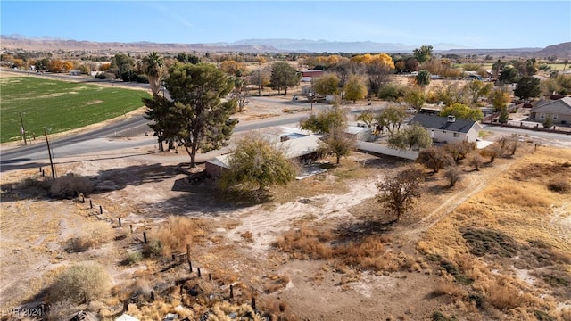 drone / aerial view featuring a mountain view and a rural view