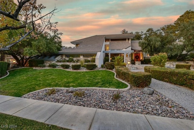 prairie-style home featuring a yard