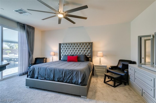 bedroom with access to exterior, light carpet, and ceiling fan