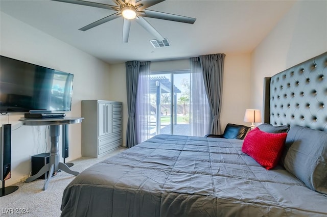 bedroom with access to exterior, visible vents, carpet floors, and a ceiling fan