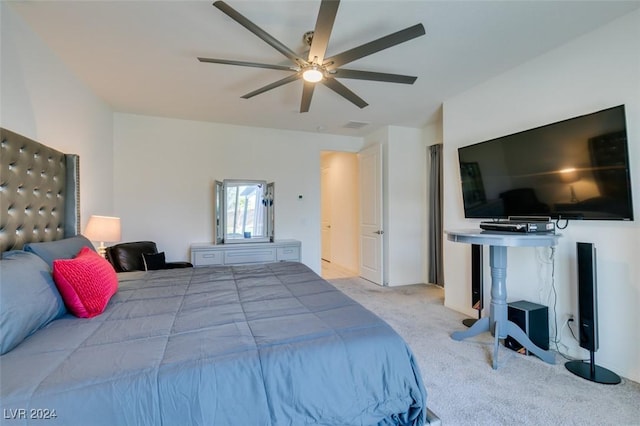 bedroom with ceiling fan and light carpet