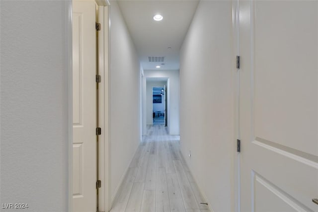 hallway featuring recessed lighting, visible vents, and light wood-style flooring