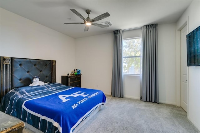 carpeted bedroom featuring ceiling fan