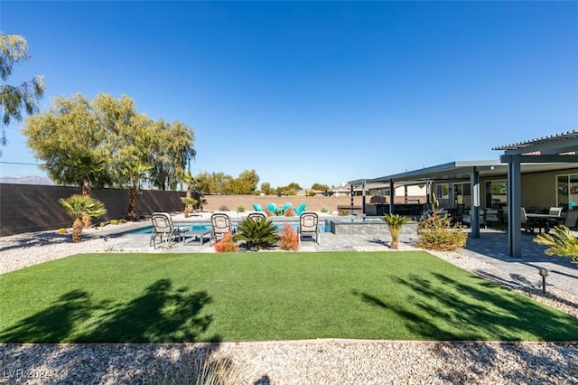 view of yard with a patio area, a fenced backyard, a fenced in pool, and a pergola