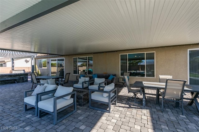 view of patio / terrace with an outdoor hangout area, a pergola, and outdoor dining space