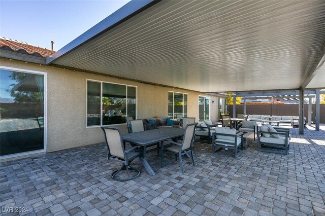 view of patio with an outdoor hangout area and outdoor dining area