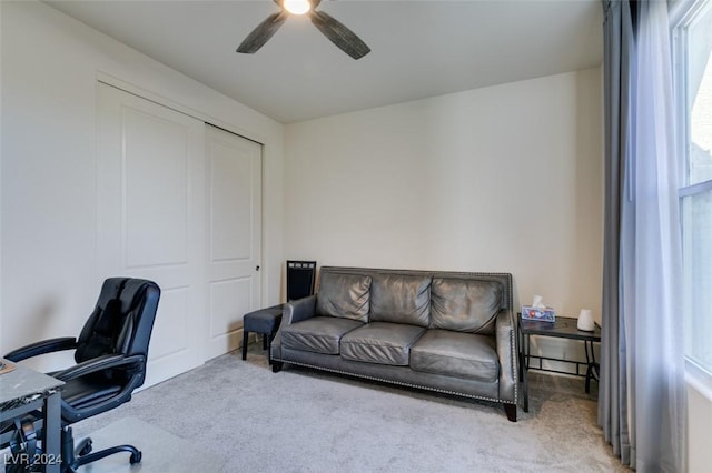 carpeted office with ceiling fan