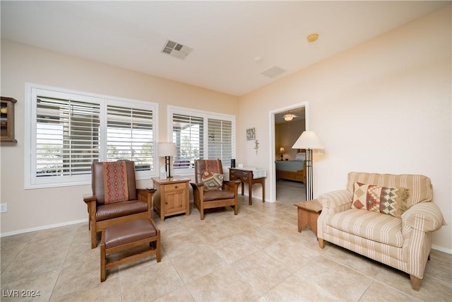 living area featuring light tile patterned floors