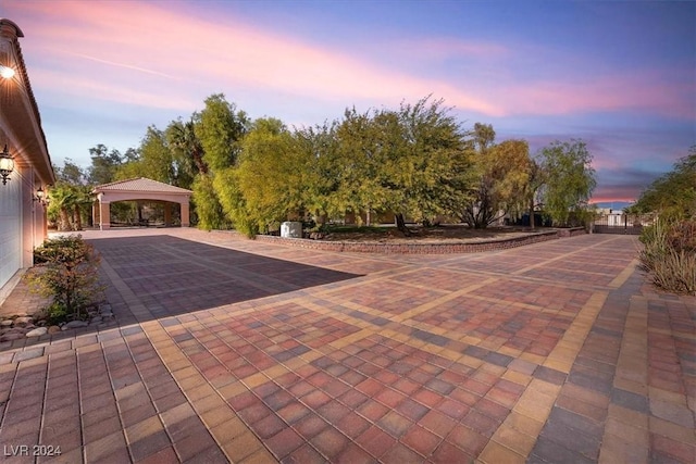 patio terrace at dusk with a gazebo