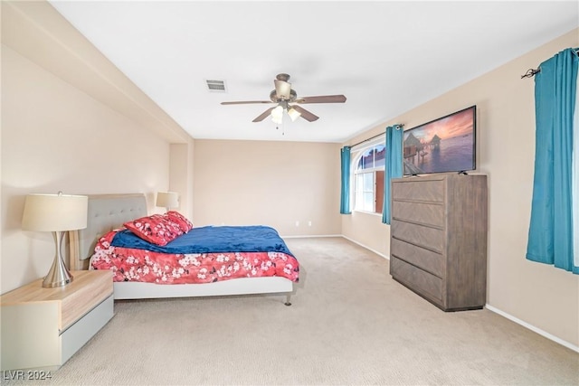 bedroom with light colored carpet and ceiling fan