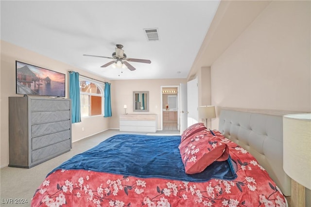 carpeted bedroom featuring connected bathroom and ceiling fan