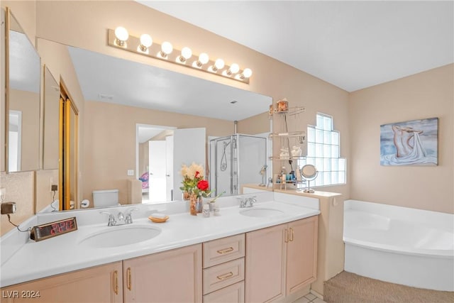 full bathroom featuring vanity, toilet, and independent shower and bath