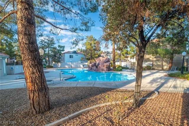 view of swimming pool with a patio area