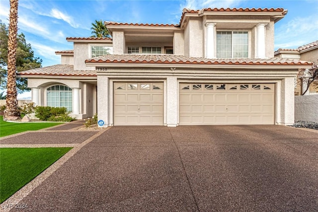 mediterranean / spanish-style home featuring a garage