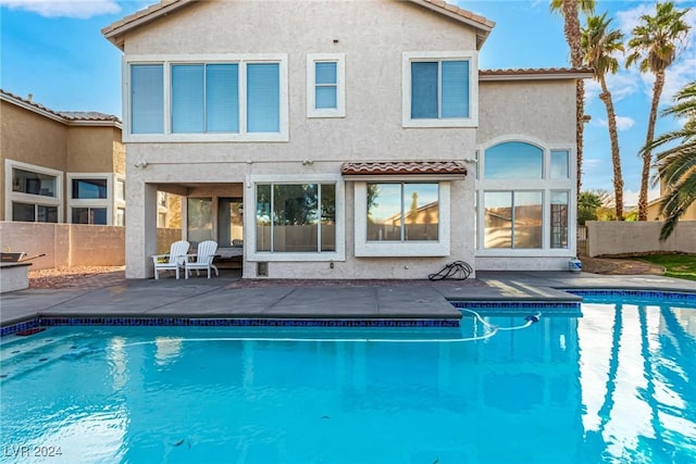 rear view of property featuring a patio