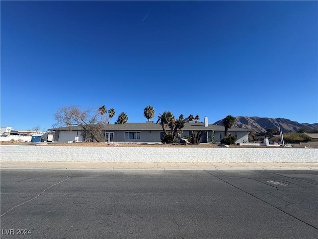 view of front of home with a mountain view