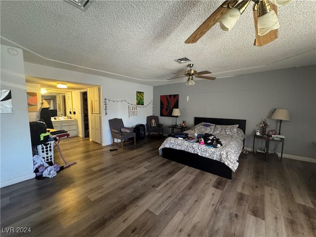 bedroom featuring hardwood / wood-style flooring, ceiling fan, and a textured ceiling