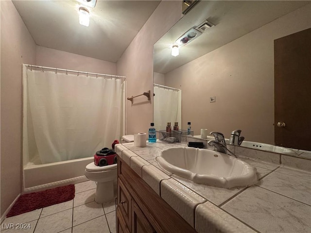 full bathroom featuring tile patterned floors, shower / tub combo with curtain, vanity, and toilet