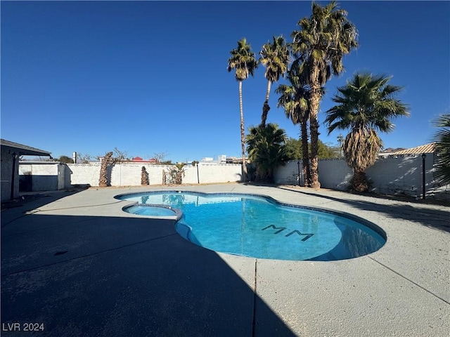 view of swimming pool featuring a patio area