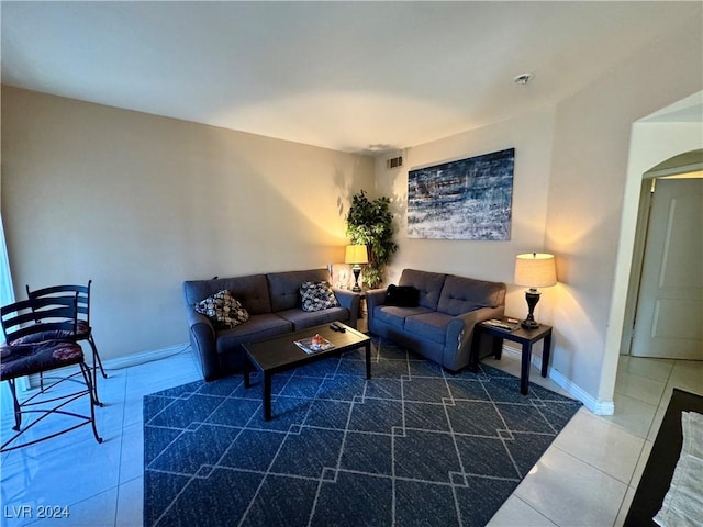 living room featuring dark tile patterned floors