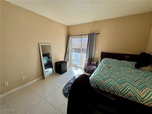 bedroom with light tile patterned floors