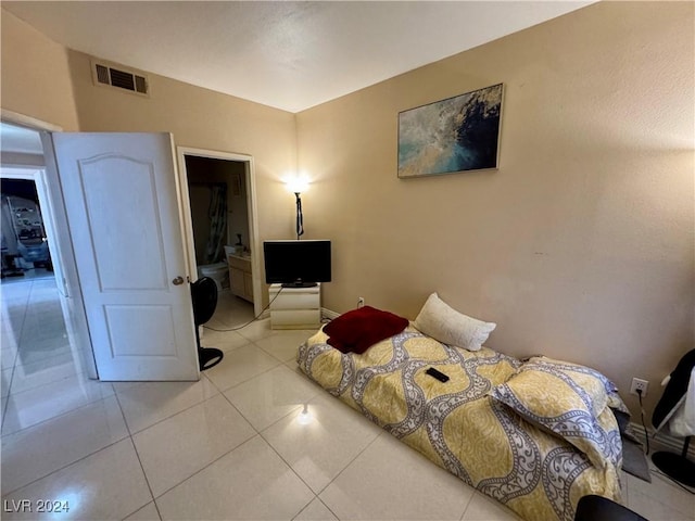 bedroom with light tile patterned floors