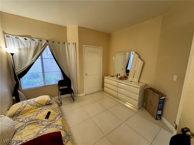 bedroom with light tile patterned flooring