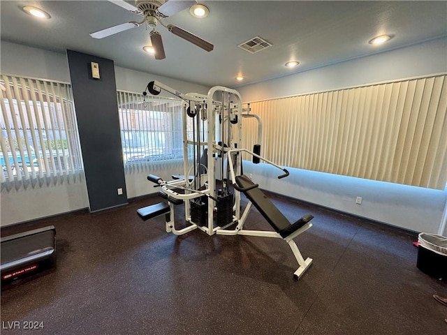 exercise area featuring ceiling fan and plenty of natural light