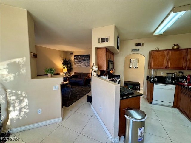 kitchen with dishwasher and light tile patterned floors