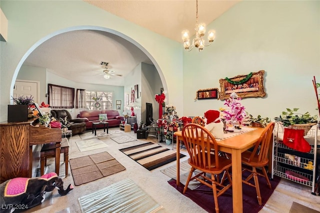 dining room featuring ceiling fan with notable chandelier