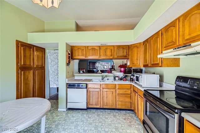 kitchen featuring sink and white appliances