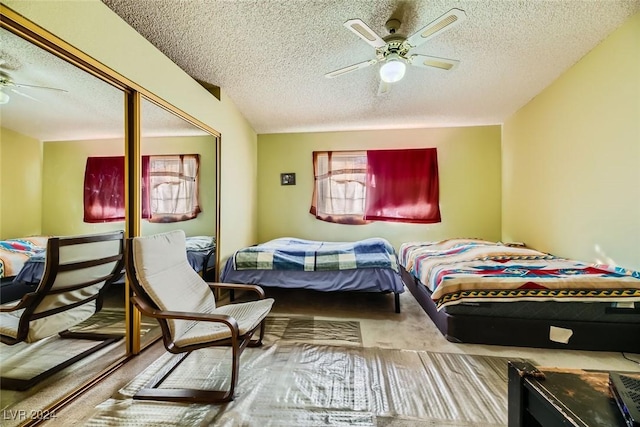 bedroom featuring a textured ceiling and ceiling fan