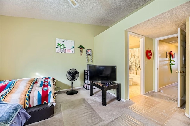 living room with a textured ceiling and light carpet