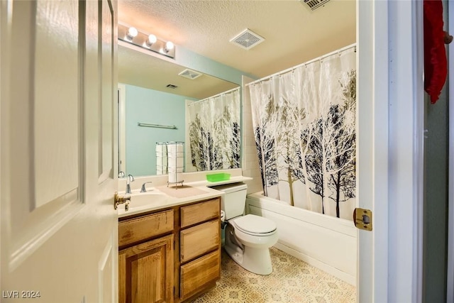 full bathroom with shower / tub combo with curtain, vanity, a textured ceiling, and toilet