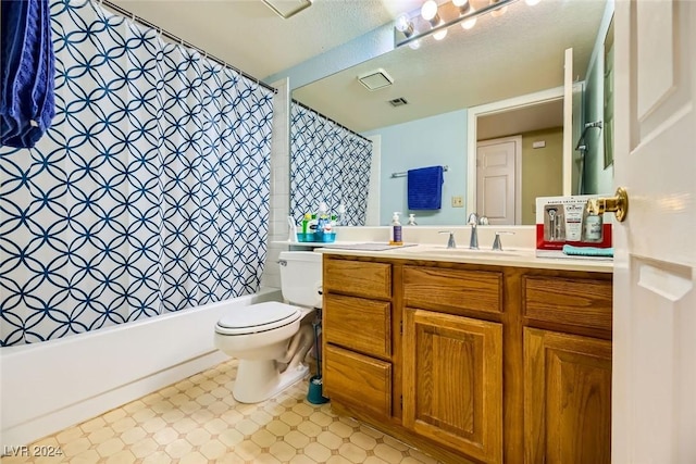 full bathroom featuring a textured ceiling, vanity, toilet, and shower / tub combo with curtain