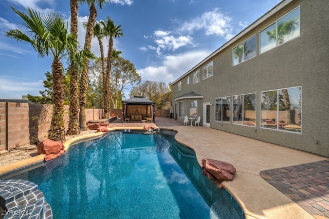 view of swimming pool with a gazebo and a patio