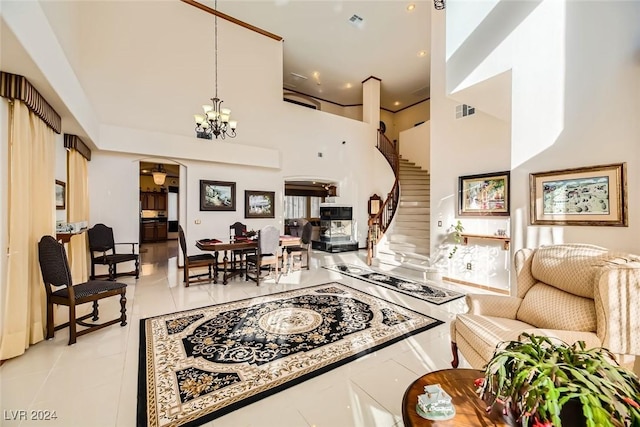 373 Via Sonador, Henderson, NV 89012 - living room featuring light tile patterned flooring, a chandelier, and a high ceiling
