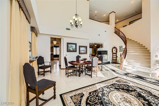 373 Via Sonador, Henderson, NV 89012 - tiled dining space with a towering ceiling and a notable chandelier