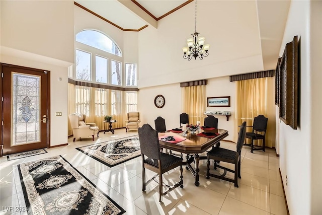 373 Via Sonador, Henderson, NV 89012 - dining area with a chandelier, light tile patterned floors, a towering ceiling, and a healthy amount of sunlight
