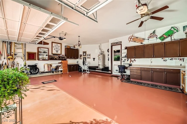 373 Via Sonador, Henderson, NV 89012 - garage featuring water heater, ceiling fan, and a garage door opener