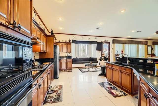 373 Via Sonador, Henderson, NV 89012 - kitchen featuring ornamental molding, light tile patterned floors, sink, and stainless steel appliances