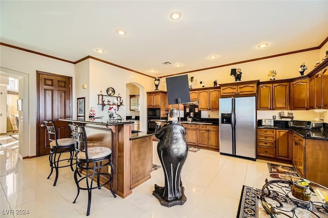 373 Via Sonador, Henderson, NV 89012 - kitchen with a breakfast bar, crown molding, stainless steel refrigerator with ice dispenser, light tile patterned floors, and black microwave