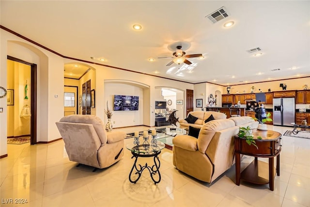 373 Via Sonador, Henderson, NV 89012 - living room with light tile patterned floors, ceiling fan, and ornamental molding