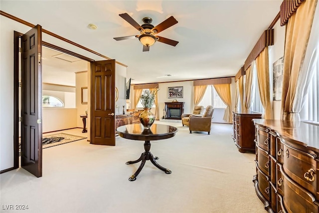 373 Via Sonador, Henderson, NV 89012 - living room featuring ceiling fan, crown molding, and light carpet