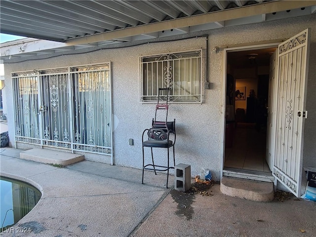 doorway to property featuring a patio area