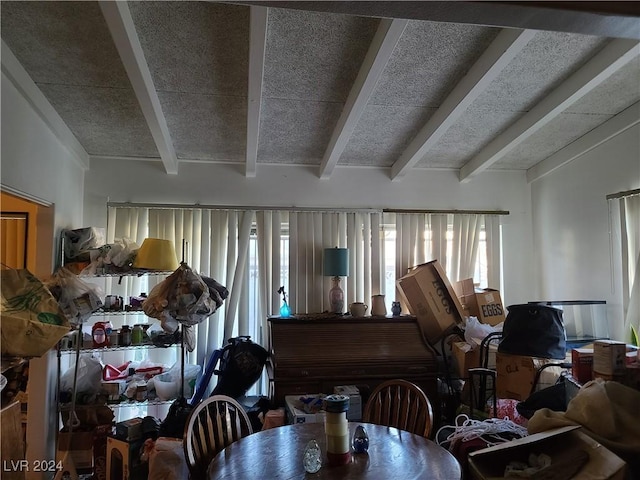 interior space featuring beam ceiling