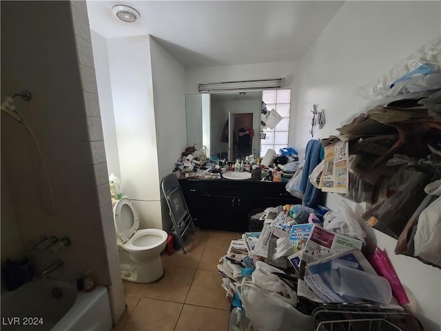 full bathroom with tile patterned flooring, vanity, washtub / shower combination, and toilet